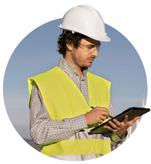 Photo of utility worker with hardhat, yellow vest and tablet.