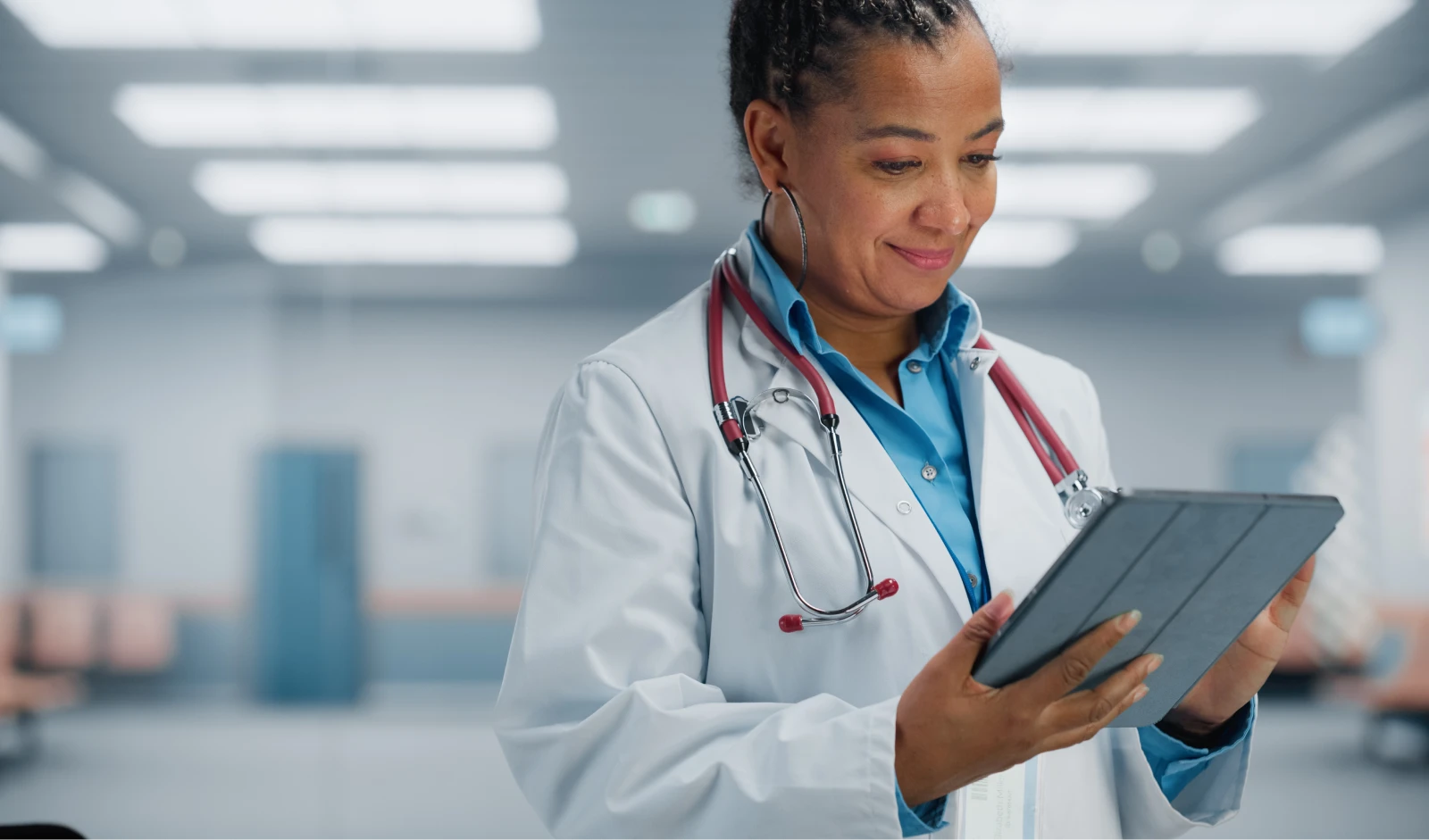 Female physician with tablet